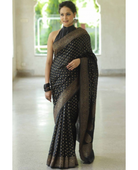 Golden motif on a soft black Lichi silk saree.
