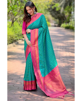 The 1000 butti concept tilak zari is featured in this green Paithani saree.