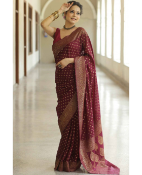 Golden motif on a soft maroon Lichi silk cloth saree.