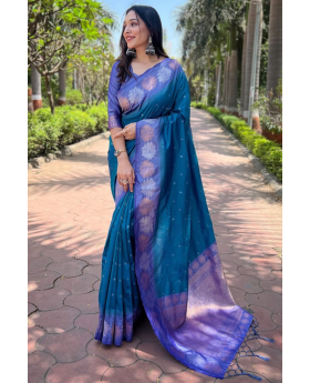 Tiny designs on a teal soft silk saree Zari Weaving