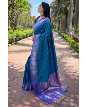 Tiny designs on a teal soft silk saree Zari Weaving