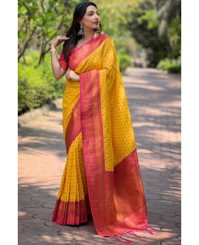 The 1000 butti concept tilak zari is featured on this yellow Paithani saree.