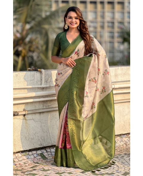 A soft silk saree in green with floral butta meenakari designs